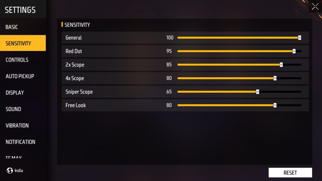 free fire sensitivity settings optimizer Free Fire settings menu with a finger adjusting the General sensitivity slider close-up